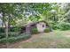 A view of the outdoor storage shed on a large and lush backyard at 4714 Marc Sw Ct, Lilburn, GA 30047