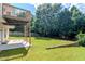 Backyard view showcasing a patio and under-deck area, ideal for relaxing outdoors at 851 Roget Ct, Lawrenceville, GA 30045