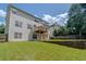 Spacious backyard featuring a tiered deck and lush green grass, perfect for outdoor entertaining at 851 Roget Ct, Lawrenceville, GA 30045