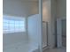 Bathroom with soaking tub and walk-in shower at 851 Roget Ct, Lawrenceville, GA 30045