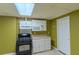 Basement kitchenette with stove, microwave and standard countertop at 851 Roget Ct, Lawrenceville, GA 30045