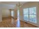 Bright living room featuring hardwood floors and large windows that bring in plenty of natural light at 851 Roget Ct, Lawrenceville, GA 30045