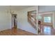 Open-concept living area with hardwood floors and elegant staircase, perfect for entertaining guests at 851 Roget Ct, Lawrenceville, GA 30045