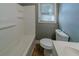 Clean bathroom featuring a tub/shower combo and a window for natural light at 1555 Rupert Rd, Decatur, GA 30032