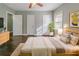 Bright bedroom with a queen bed, modern décor, and ample natural light from the window at 1555 Rupert Rd, Decatur, GA 30032