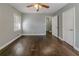 Comfortable bedroom featuring refinished hardwood floors and large windows at 1555 Rupert Rd, Decatur, GA 30032