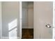 Open closet shows dark wood floors, a shelf, and light-grey walls at 1555 Rupert Rd, Decatur, GA 30032