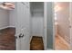 This is a walk-in closet off a bedroom with dark-wood floors and a shelf at 1555 Rupert Rd, Decatur, GA 30032