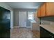 Functional kitchen space showing neutral walls and floors, as well as a washer and dryer at 1555 Rupert Rd, Decatur, GA 30032