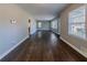 Spacious living room with newly finished hardwood floors and ample natural light at 1555 Rupert Rd, Decatur, GA 30032