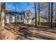 Rear exterior view of a home with bay window, back deck, and partially fenced yard at 2105 Sandtree Sw Ct, Atlanta, GA 30331