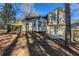 Exterior back view of a home featuring a bay window, deck, and partially fenced backyard at 2105 Sandtree Sw Ct, Atlanta, GA 30331