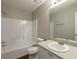 Bathroom featuring a shower-tub combo, vanity with framed mirror, and wood look flooring at 2105 Sandtree Sw Ct, Atlanta, GA 30331