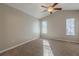 Bright bedroom featuring a ceiling fan and natural light from two windows at 2105 Sandtree Sw Ct, Atlanta, GA 30331