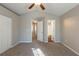 Carpeted bedroom with closets and multiple entryways at 2105 Sandtree Sw Ct, Atlanta, GA 30331