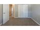 Bedroom with carpet, light gray walls, white trim, and double closet doors at 2105 Sandtree Sw Ct, Atlanta, GA 30331