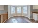 Charming dining area with bright bay windows and hardwood flooring at 2105 Sandtree Sw Ct, Atlanta, GA 30331