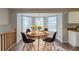 Cozy dining nook with bay window offers natural light and wood flooring at 2105 Sandtree Sw Ct, Atlanta, GA 30331