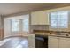 Cozy dining area with bay windows, adjacent to the kitchen area at 2105 Sandtree Sw Ct, Atlanta, GA 30331