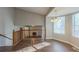 Open dining room with wood floors and natural light from large windows at 2105 Sandtree Sw Ct, Atlanta, GA 30331
