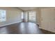 Spacious living area showcasing hardwood floors and a bright, welcoming entryway at 2105 Sandtree Sw Ct, Atlanta, GA 30331