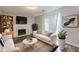 Inviting living room with modern furnishings and a fireplace creates a cozy atmosphere at 2105 Sandtree Sw Ct, Atlanta, GA 30331