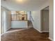 Open-concept living space with hardwood floors leads to a kitchen area with stairs at 2105 Sandtree Sw Ct, Atlanta, GA 30331