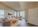 Bright living room with vaulted ceilings, large windows, and hardwood floors at 2105 Sandtree Sw Ct, Atlanta, GA 30331