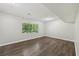 Finished basement space with wood-look flooring and a large window for natural light at 2920 Cushing Ct, Jonesboro, GA 30236