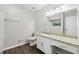 Bathroom featuring granite vanity, white cabinets, and a large mirror at 2920 Cushing Ct, Jonesboro, GA 30236