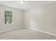 Bedroom featuring a large window to let in the sunshine, neutral walls and carpet at 2920 Cushing Ct, Jonesboro, GA 30236