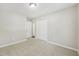Well-lit bedroom with neutral walls, carpet, a closet and an open door at 2920 Cushing Ct, Jonesboro, GA 30236