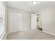 Bright bedroom featuring neutral walls, carpet, a closet and an open door at 2920 Cushing Ct, Jonesboro, GA 30236