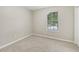 Bedroom with neutral walls, carpet flooring, closet, and a window for natural light at 2920 Cushing Ct, Jonesboro, GA 30236