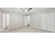 Spacious bedroom featuring neutral walls, carpet, a closet and two open doors at 2920 Cushing Ct, Jonesboro, GA 30236