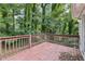 A wood deck overlooking a green, tree-filled backyard at 2920 Cushing Ct, Jonesboro, GA 30236