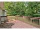 A wood deck overlooking a green, tree-filled backyard at 2920 Cushing Ct, Jonesboro, GA 30236