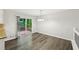 Dining area with sliding doors to backyard deck and gray wood-look floors at 2920 Cushing Ct, Jonesboro, GA 30236