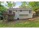Exterior photo of home featuring a deck overlooking the private backyard, a natural setting with trees at 2920 Cushing Ct, Jonesboro, GA 30236