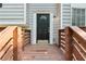 Close-up of a welcoming front door with decorative glass and wooden railings, inviting you to step inside at 2920 Cushing Ct, Jonesboro, GA 30236