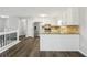 Bright kitchen features stainless steel appliances, granite countertops, and white cabinetry at 2920 Cushing Ct, Jonesboro, GA 30236