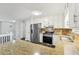 Bright kitchen features stainless steel appliances, granite countertops, and white cabinetry at 2920 Cushing Ct, Jonesboro, GA 30236