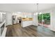Open floorplan kitchen features stainless appliances, white cabinets, and granite countertops with deck access at 2920 Cushing Ct, Jonesboro, GA 30236
