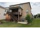 Beautiful backyard featuring a two story deck with stairs on a well maintained lawn at 4933 Greenard Watson Ln, Buford, GA 30518
