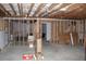 Unfinished basement featuring exposed framing, utilities, and a blank canvas for customization at 4933 Greenard Watson Ln, Buford, GA 30518