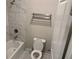 Bathroom with a white tile shower and bath at 4933 Greenard Watson Ln, Buford, GA 30518
