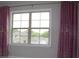 Bedroom features a window with floral curtains and scenic outside views at 4933 Greenard Watson Ln, Buford, GA 30518
