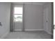 Bright bedroom featuring a window with curtains and neutral walls and carpet at 4933 Greenard Watson Ln, Buford, GA 30518
