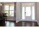Bright dining area with a white trimmed door and large window for ample light at 4933 Greenard Watson Ln, Buford, GA 30518
