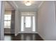 Bright foyer featuring a white front door with glass accents and hardwood floors at 4933 Greenard Watson Ln, Buford, GA 30518